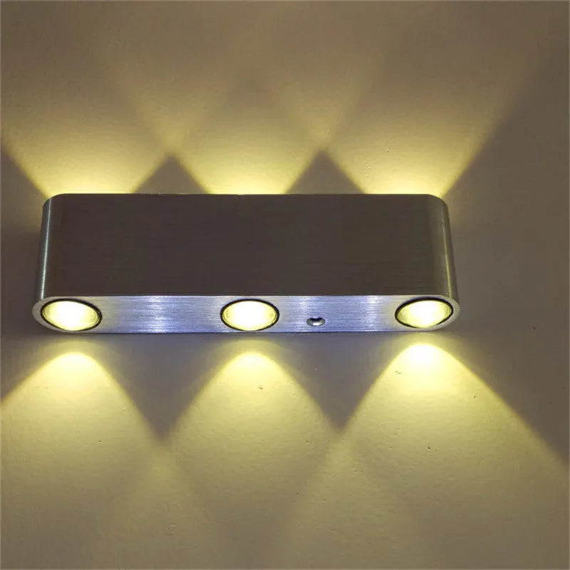Silver aluminium rectangular LED wall lamp with multicolour lighting options on bedroom wall