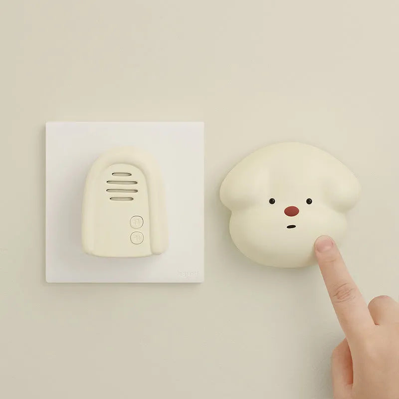 Wireless plug-in doorbell with self-generating chime in milky yellow or white colour options