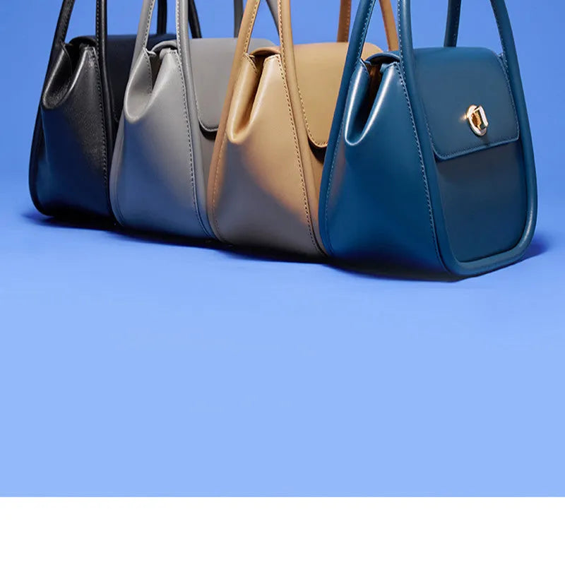 Wing shape cow leather cross-body handbag with buckle detail and fabric lining