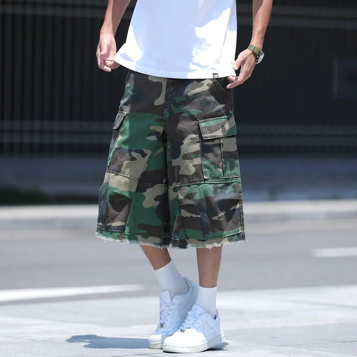 American retro workwear camouflage shorts with polyurethane trim in loose-fit cropped design