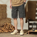 Loose cargo trousers in stretch cotton, fifth pants length, multi-pocket, available in gray, black, khaki, and Army Green