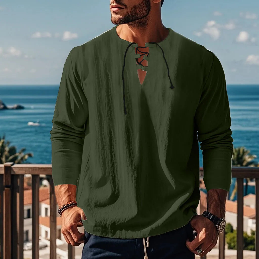 Man wearing a loose fit solid colour cotton linen beach shirt in a casual setting.