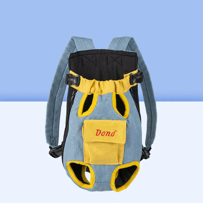 A person wearing a blue and yellow front-carry pet sling backpack containing a small dog, with adjustable cross-shoulder straps.