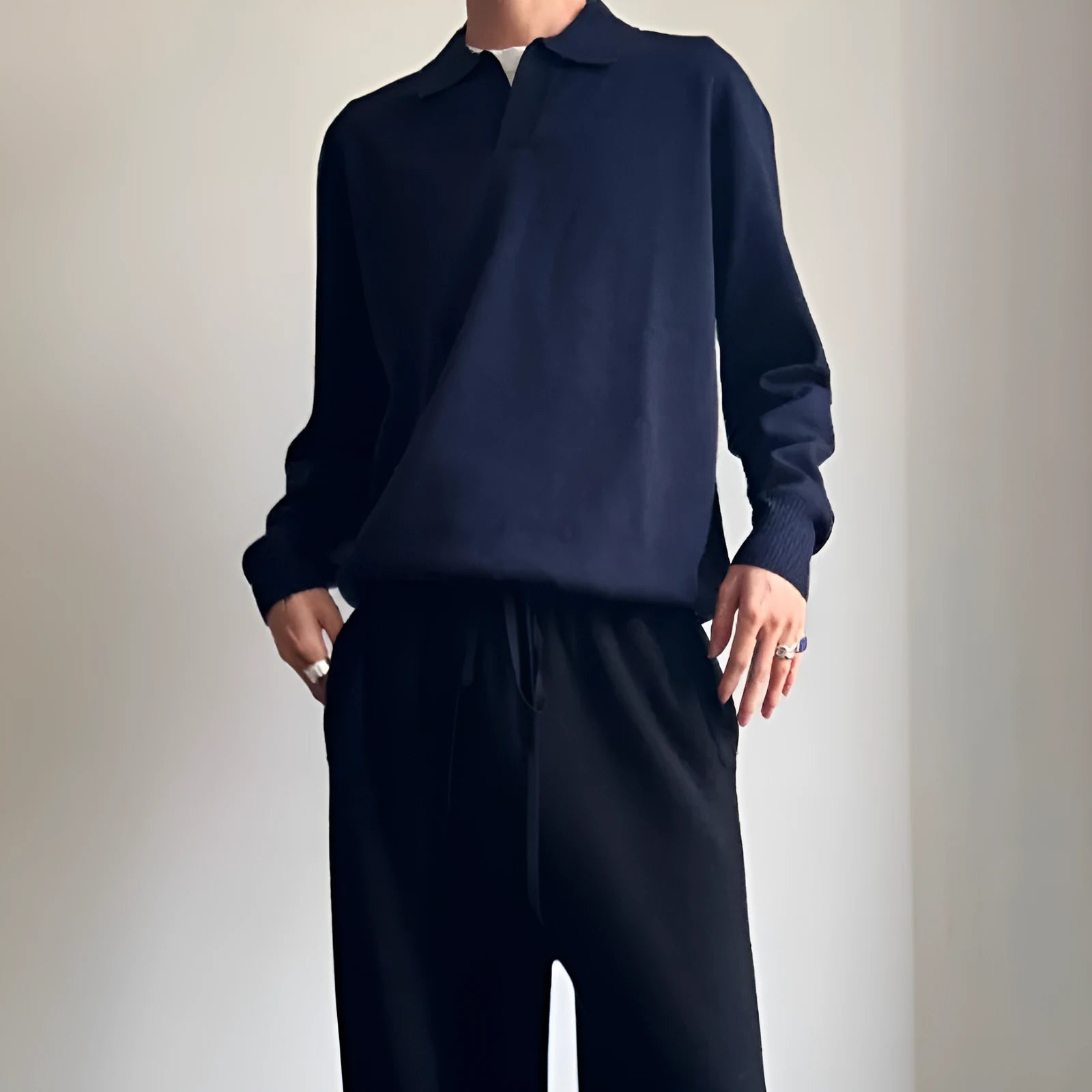 Man's milky white pure wool polo neck sweater with lapel collar and long sleeves.