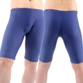Green and navy blue men's loose-fit swimming trunks with a five-point design and polyester lining.
