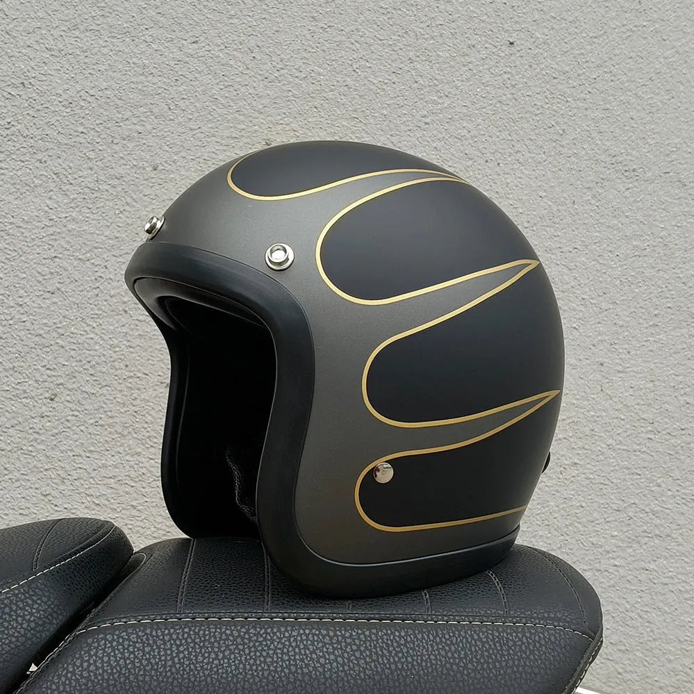A retro-style grey half helmet for motorcycle riding, shown on a stand.