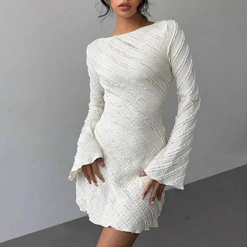 White knitted boat neck back tie dress with flared sleeves and pleated puff skirt
