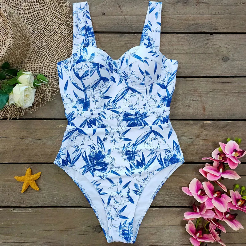 One-piece white polyester ladies swimsuit with printed pattern and gather design, sleeveless
