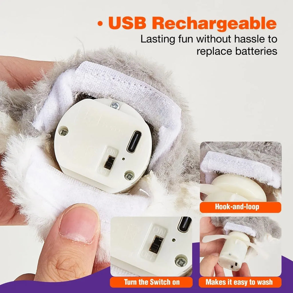 Grey automatic chirping owl cat toy with beating wings on a flat surface.