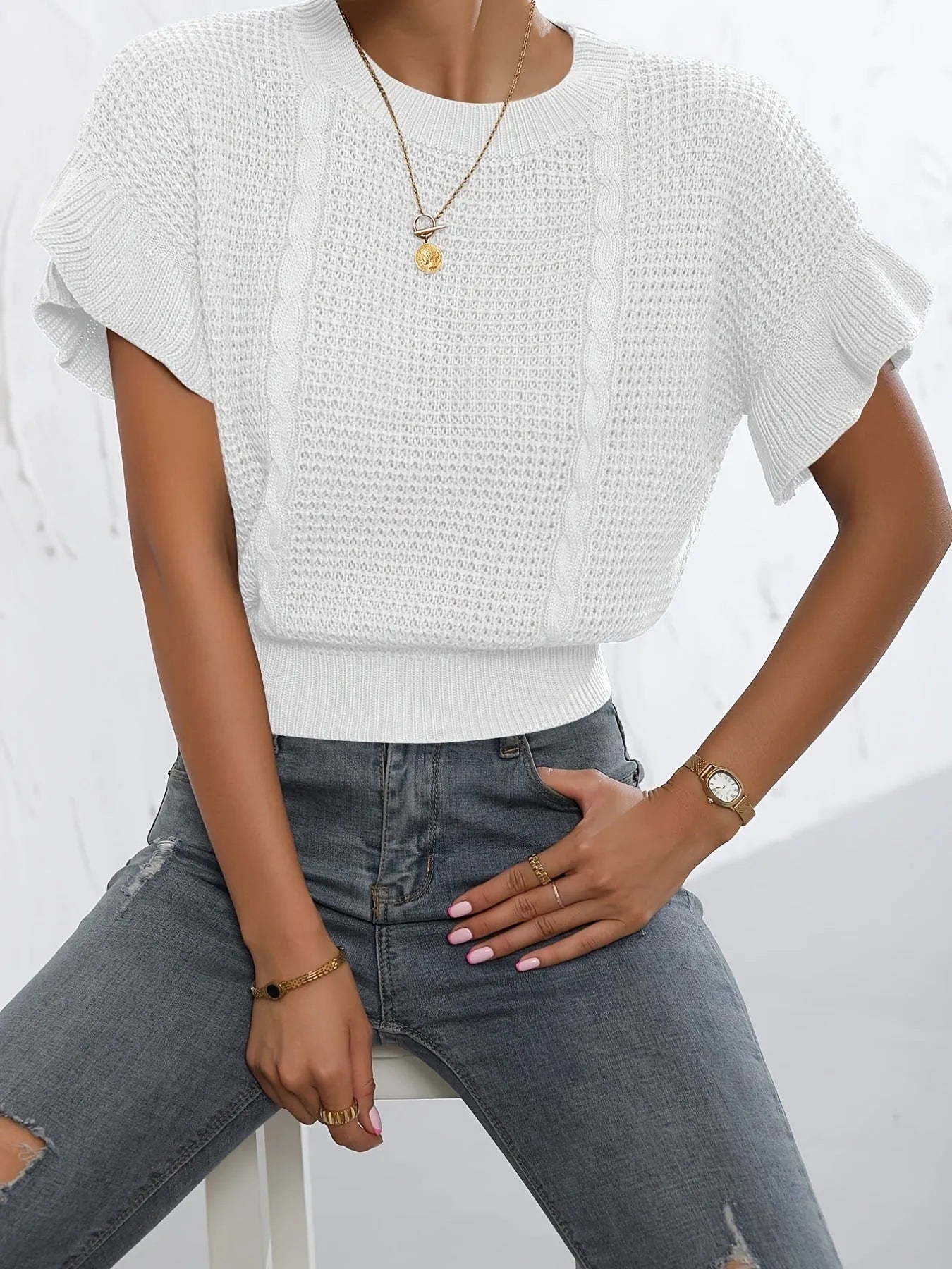 Twisted string design knitted pullover sweater with ruffled short sleeves in loose fit.