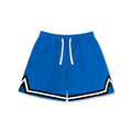 Man wearing loose-fit black polyester sports shorts for summer leisure activities.