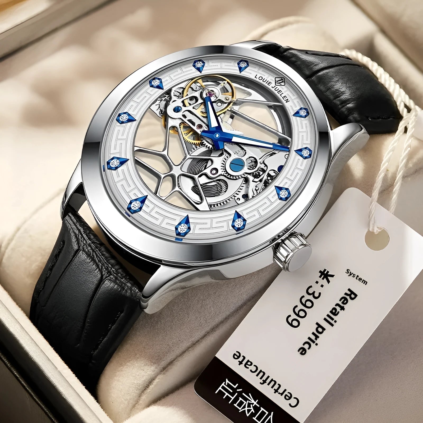 Men's silver case mechanical watch with white dial, blue hands, and a black leather strap.