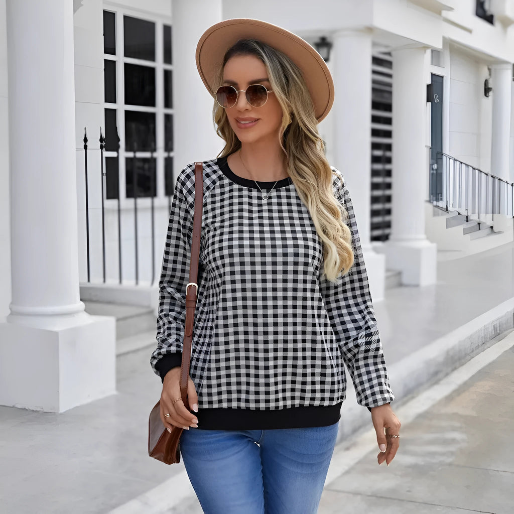 Black long sleeve pullover sweater with plaid and striped printed pattern