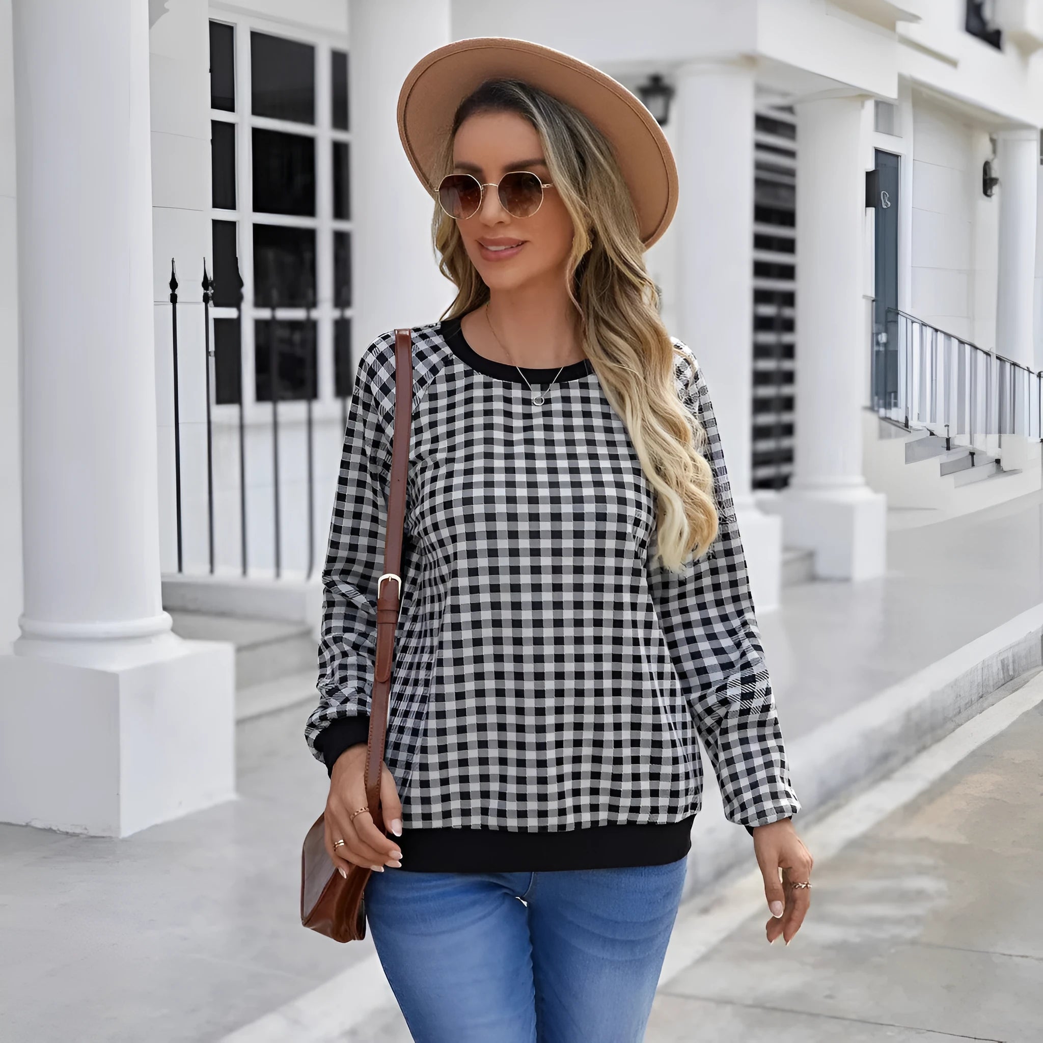 Black long sleeve pullover sweater with plaid and striped printed pattern