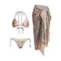 Women's creamy white floral bikini set with halter top, high-waisted briefs and matching skirt
