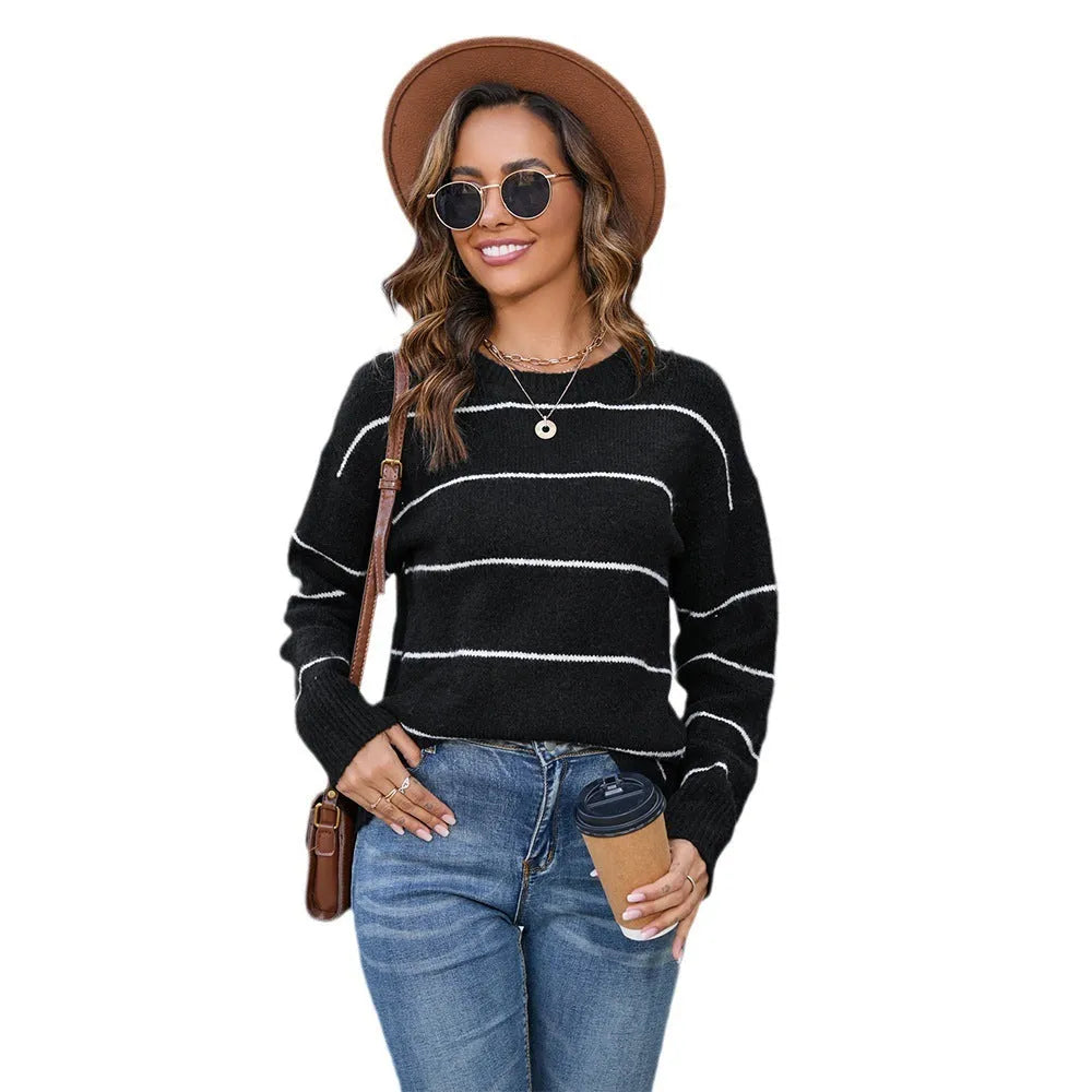 Women's striped pullover sweater in black and white with round neck and loose street fashion styling