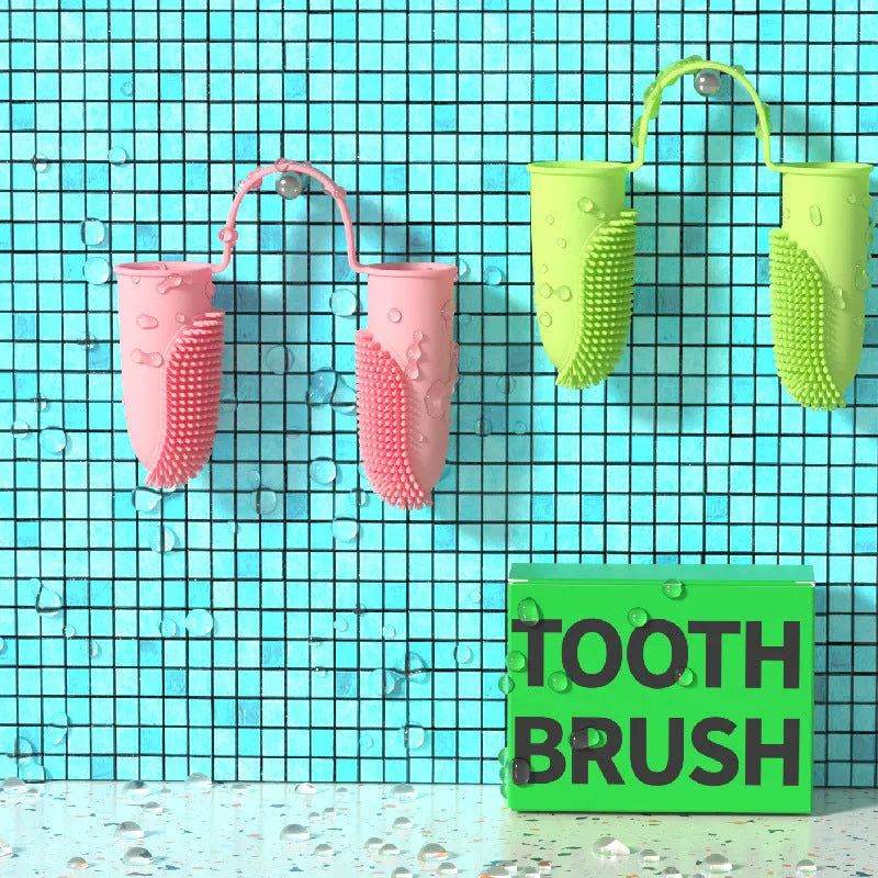 Close-up of blue green and pink silicone finger sleeves for pet dental cleaning on a hand.