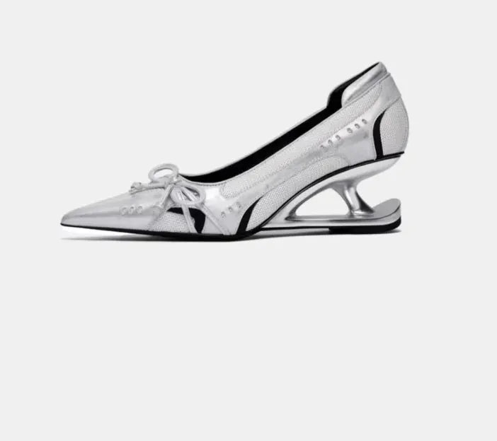 Women's black pointed toe Mary Jane shoes with a distinctive shaped floating heel and slip-on design.
