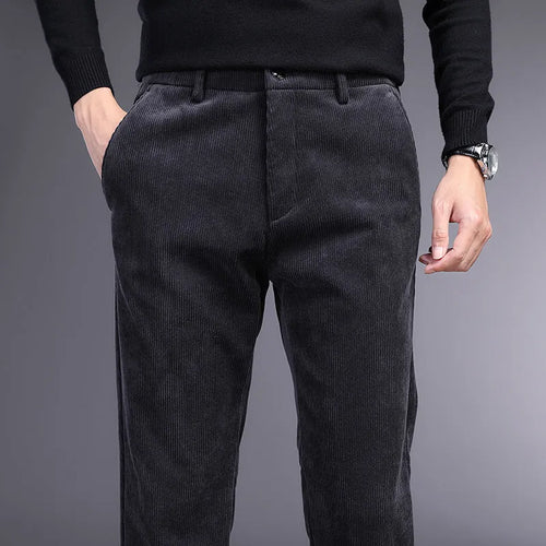 Straight-leg striped trousers in a khaki colour, showing the zip fly front and classic fit.