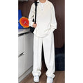 Men's black casual two-piece suit with long sleeve polo shirt and matching trousers in slim fit design