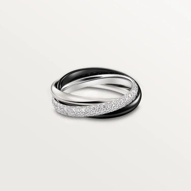A pair of silver couple rings with a full diamond setting and U-shaped geometric design on a grey background.