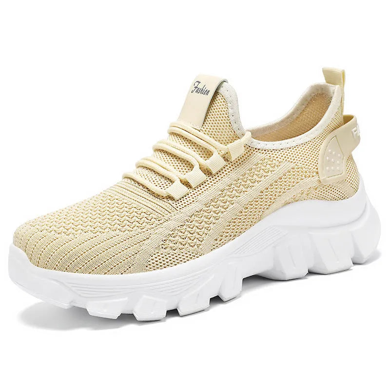 Women's white Flyknit running sneakers with thick PVC sole and lace-up front.