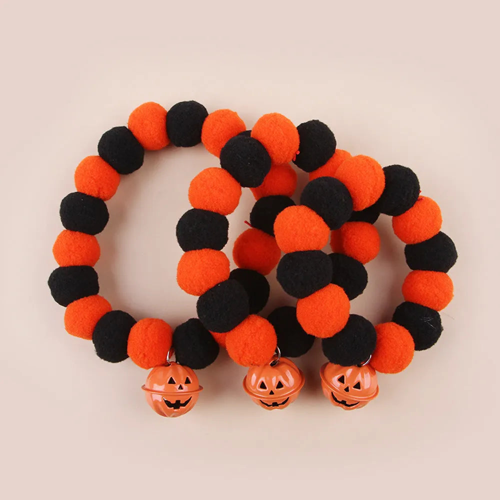 Orange and black Halloween cat collar with pumpkin design and plastic quick-release buckle.