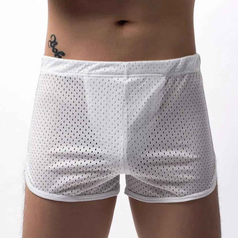 Men's black three-point boxer shorts made from a knitted cotton and nylon blend on a plain background.