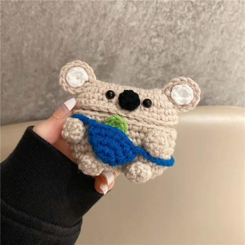 Hand knitted AirPods protective sleeve with koala bear backpack design on Apple AirPods case