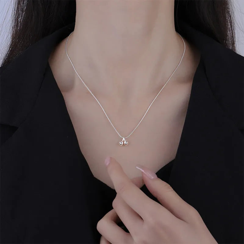 Silver cherry pendant necklace on a snake bone chain, adjustable length, Korean style.