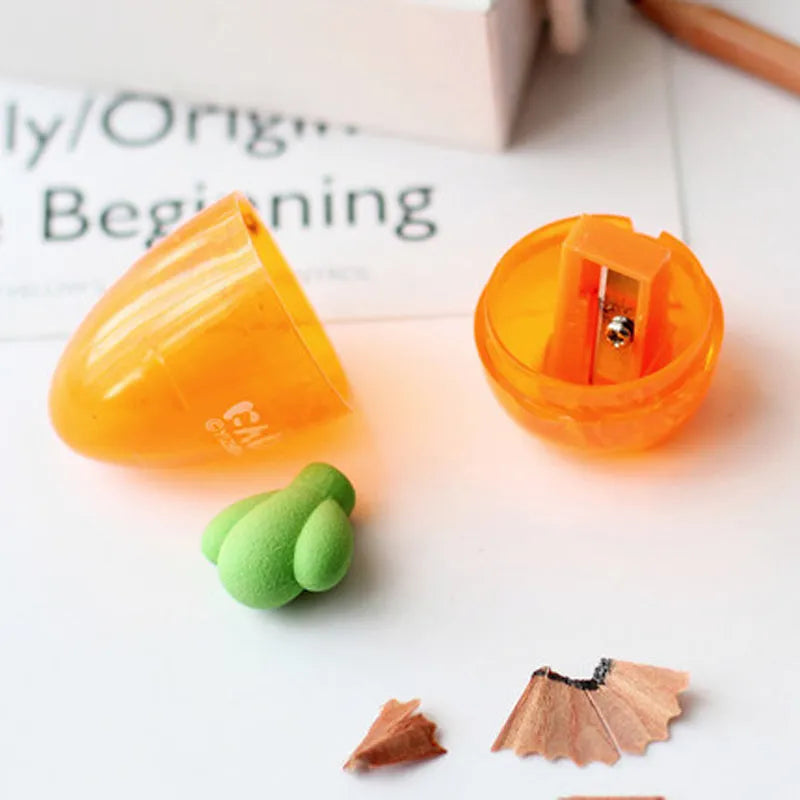 Carrot-shaped plastic pencil sharpener with 7cm handle in carrot colour