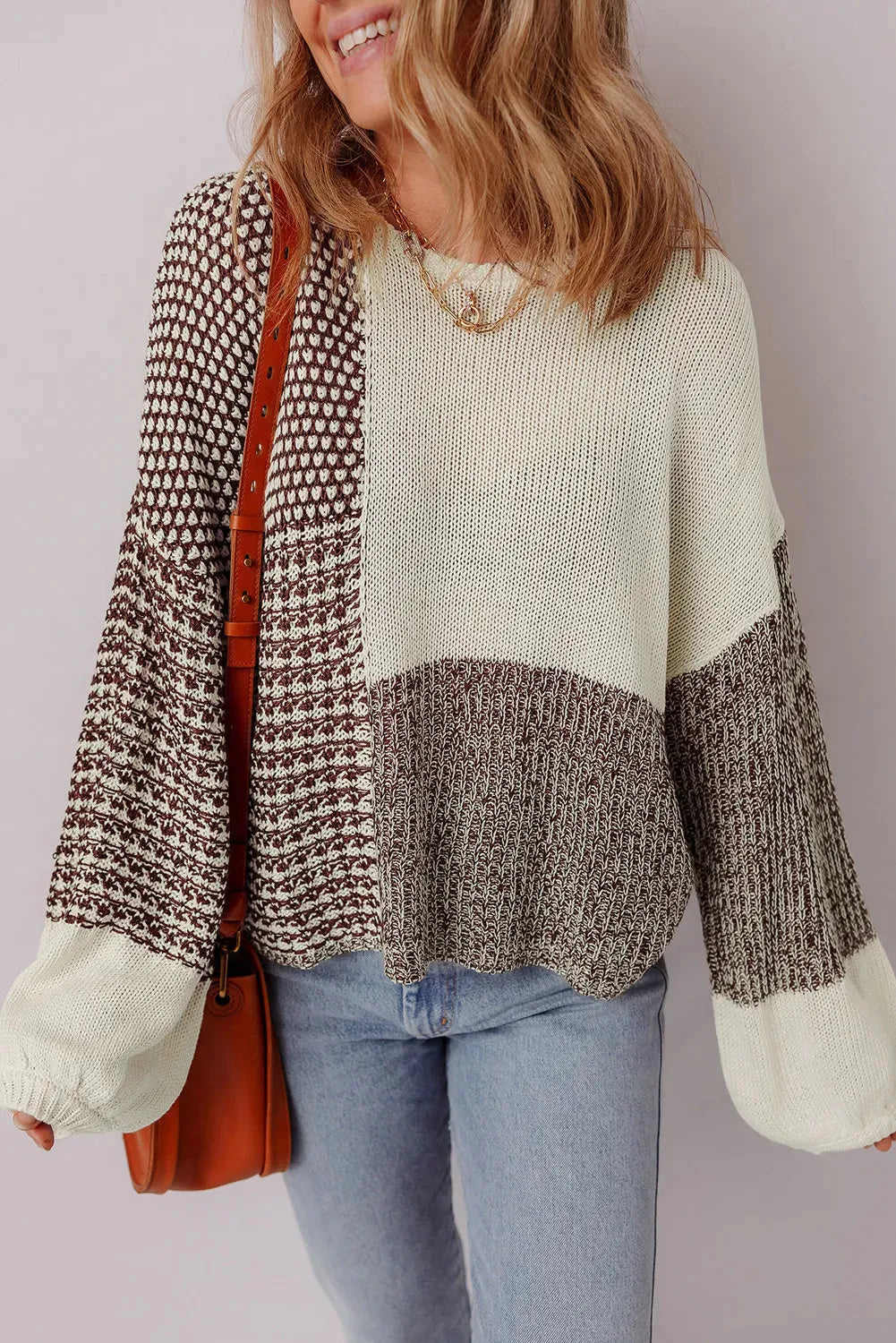 Dark khaki loose fit sweater showing back tie detail on colour block panel.