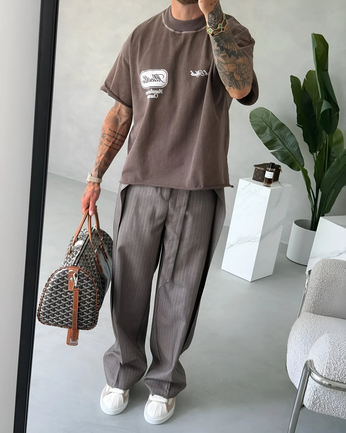 Men's casual striped lace-up polyester trousers in regular fit, front view.