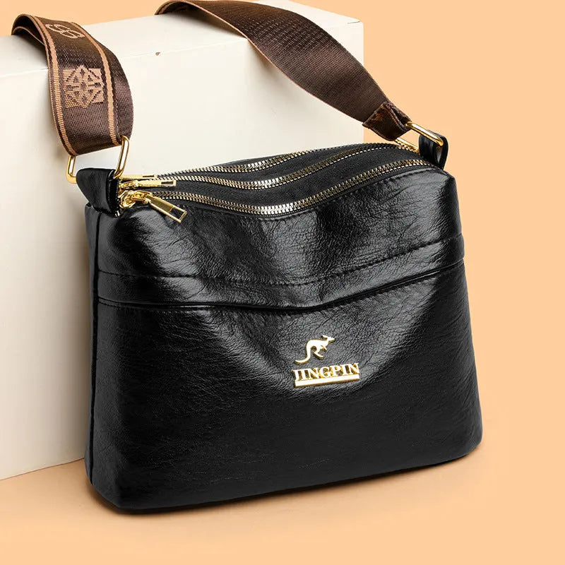 PU leather cross body messenger bag with multiple compartments in horizontal square suitcase shape