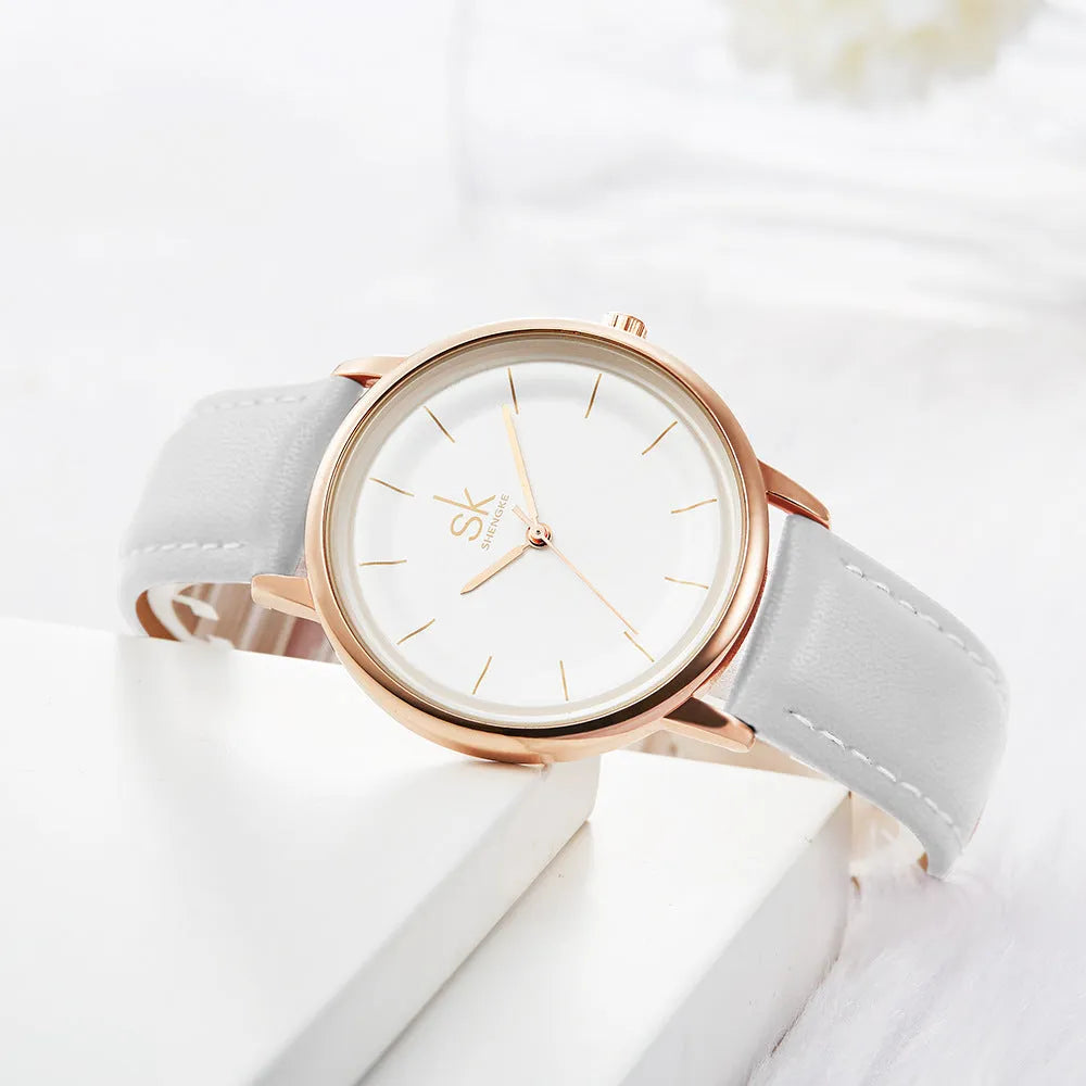 Women's quartz watch with round rose gold alloy case and white PU strap, 38mm dial, stainless steel buckle