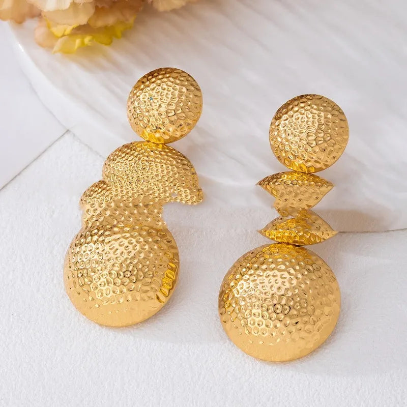 Retro women's polka dot metal bead drop earrings in frosted gold finish on a neutral background