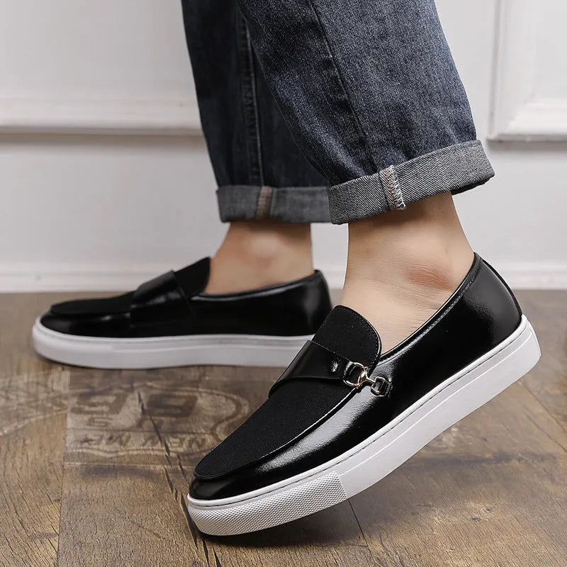 Men's black artificial leather slip-on shoes with a gold horsebit buckle and round toe on a rubber sole.