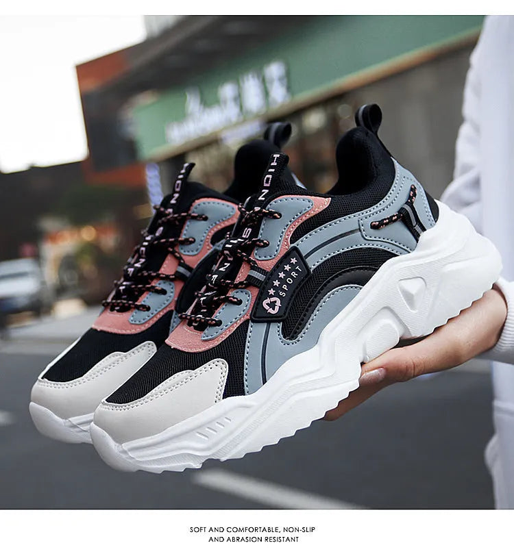 White women's thick-soled casual trainers with mesh upper and buckle detail