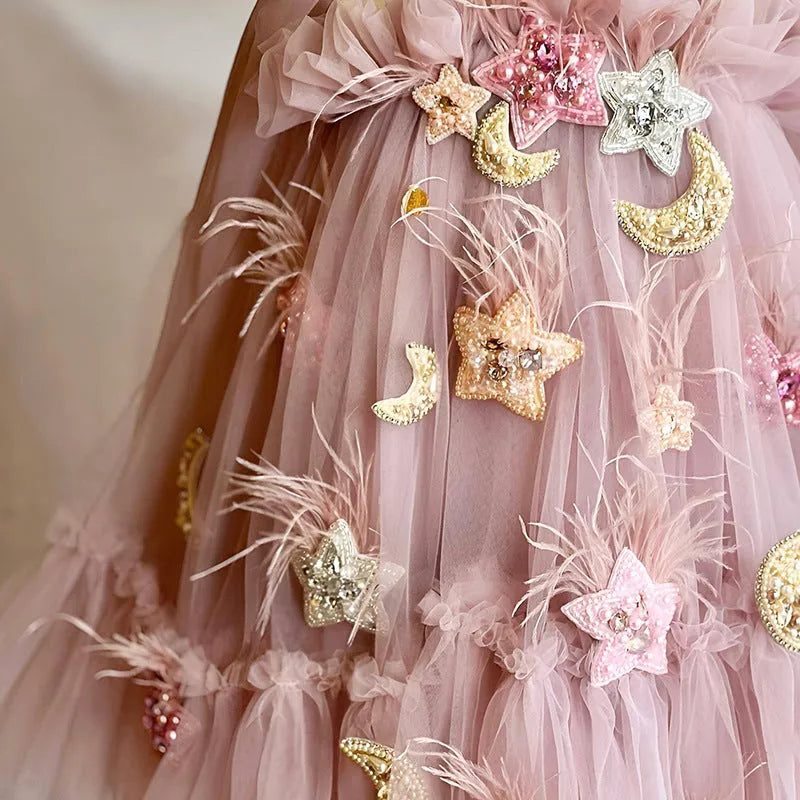 Pink floral children's princess dress with spaghetti straps and bow detail