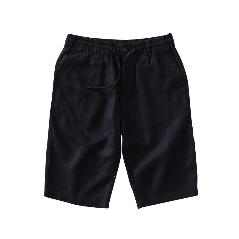 Men's loose-fitting linen capri trousers in a straight-leg style on a neutral background.