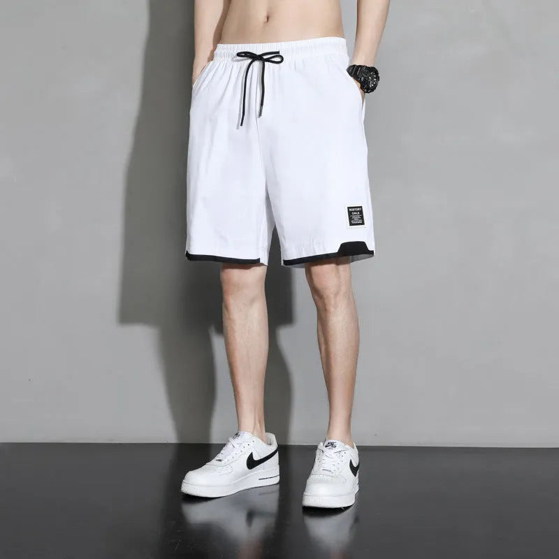 Boy wearing black cotton plus-size shorts with a mid-waist and casual overalls style.