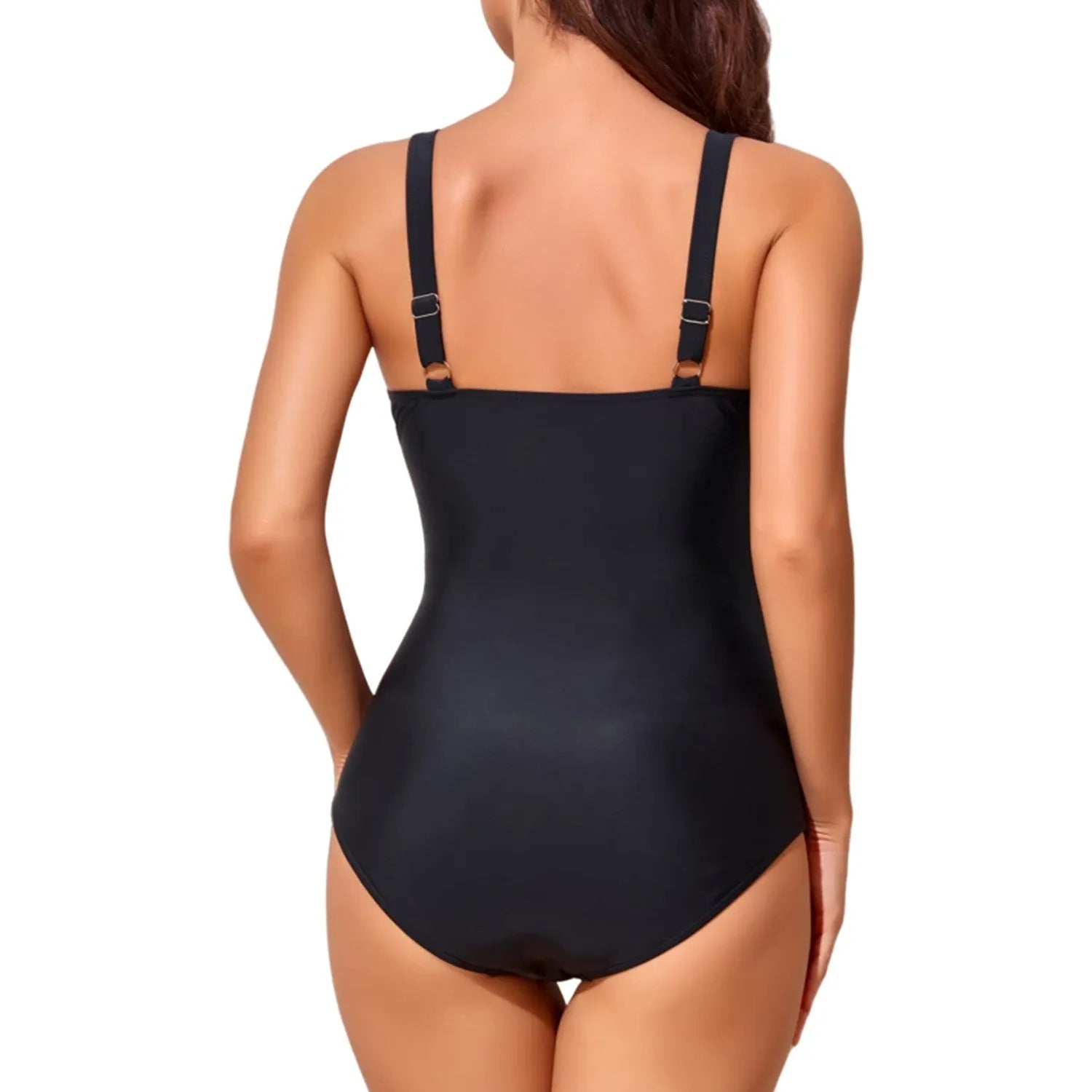 Black one-piece swimsuit on a model showing deep V-neck cross front with pleated detail.