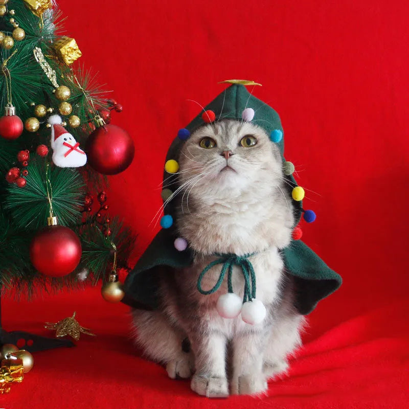 Red polar fleece Christmas cloak with hood for dog or cat wearing antler pattern design.