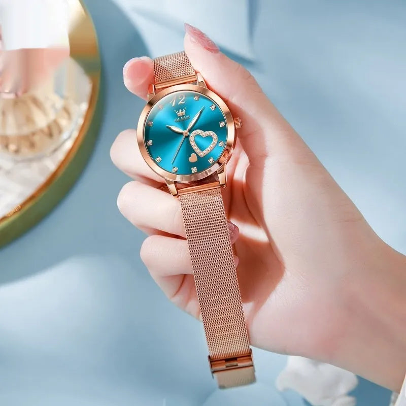 Women's fashion watch with rose shell alloy case and mesh strap, shown in multiple dial colour options.