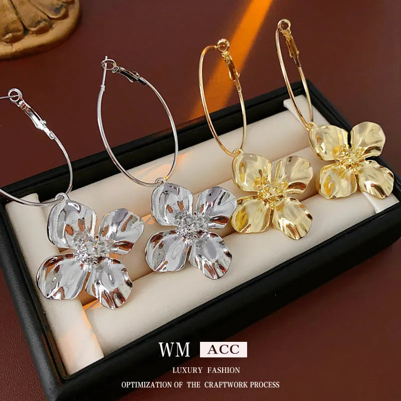 Vintage silver and gold metal flower earrings with geometric shapes and electroplated finish.