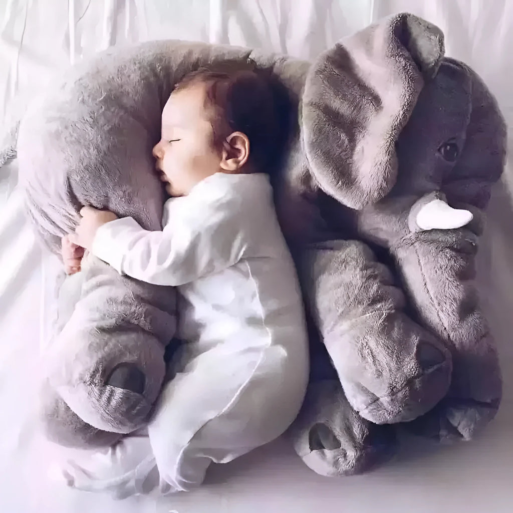 Soft grey elephant plush pillow case for baby sleeping companion on a bed