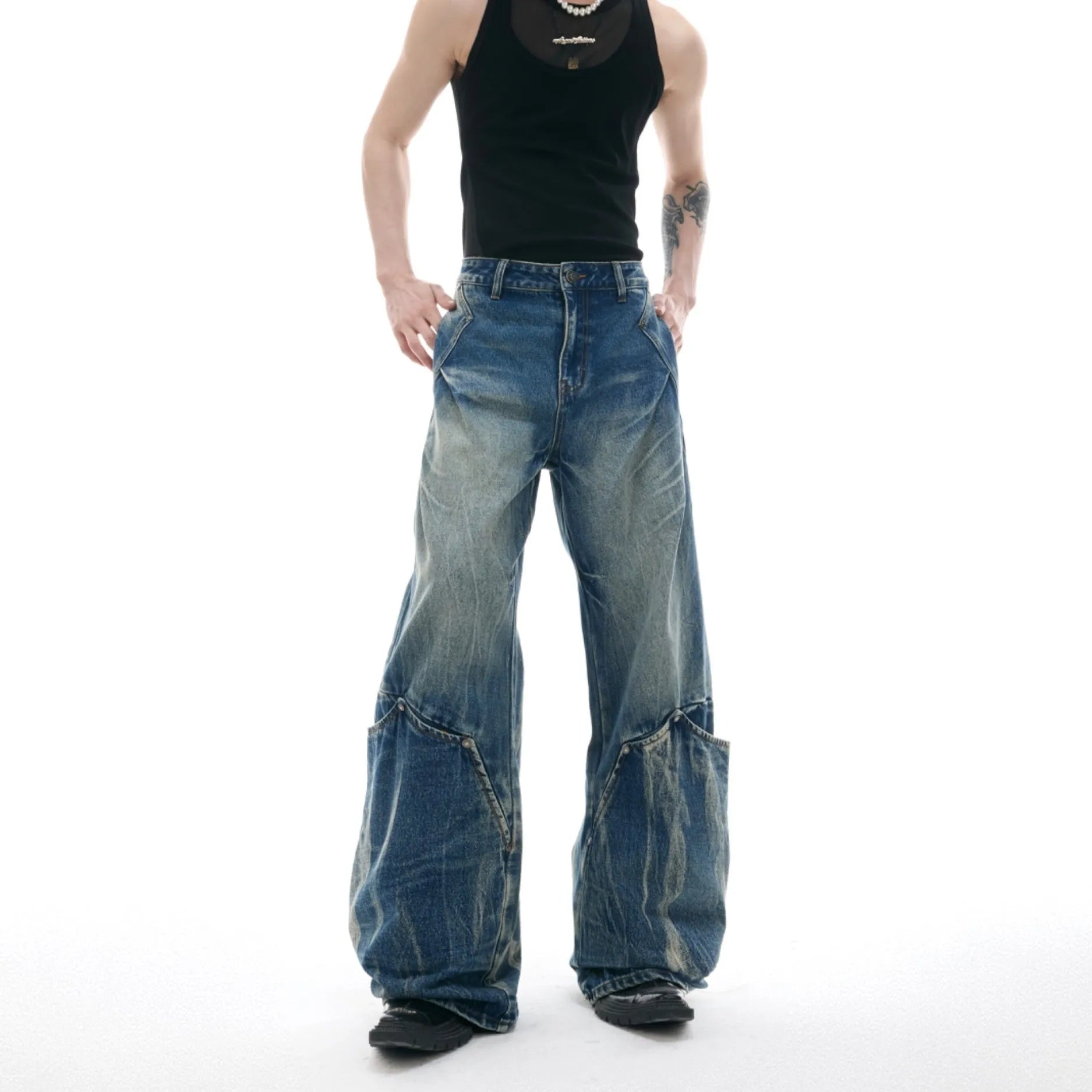 Men's verdant blue jeans with retro washed burst pattern and curved knife silhouette in loose fit