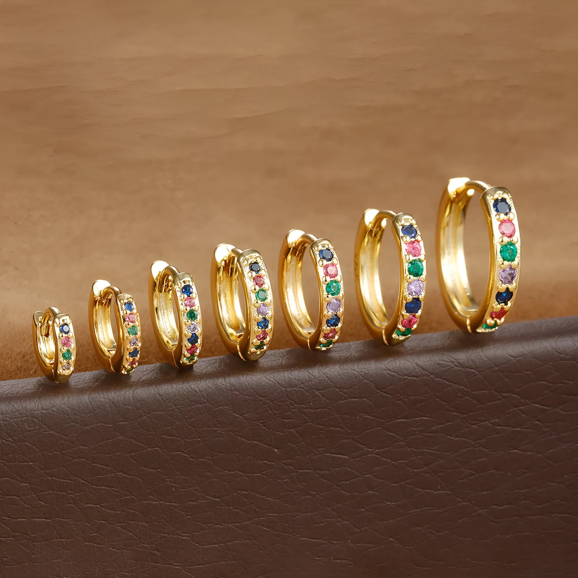 Circle geometric zircon stud earrings in gold, rose gold, and silver colours showing 5mm to 12mm size range