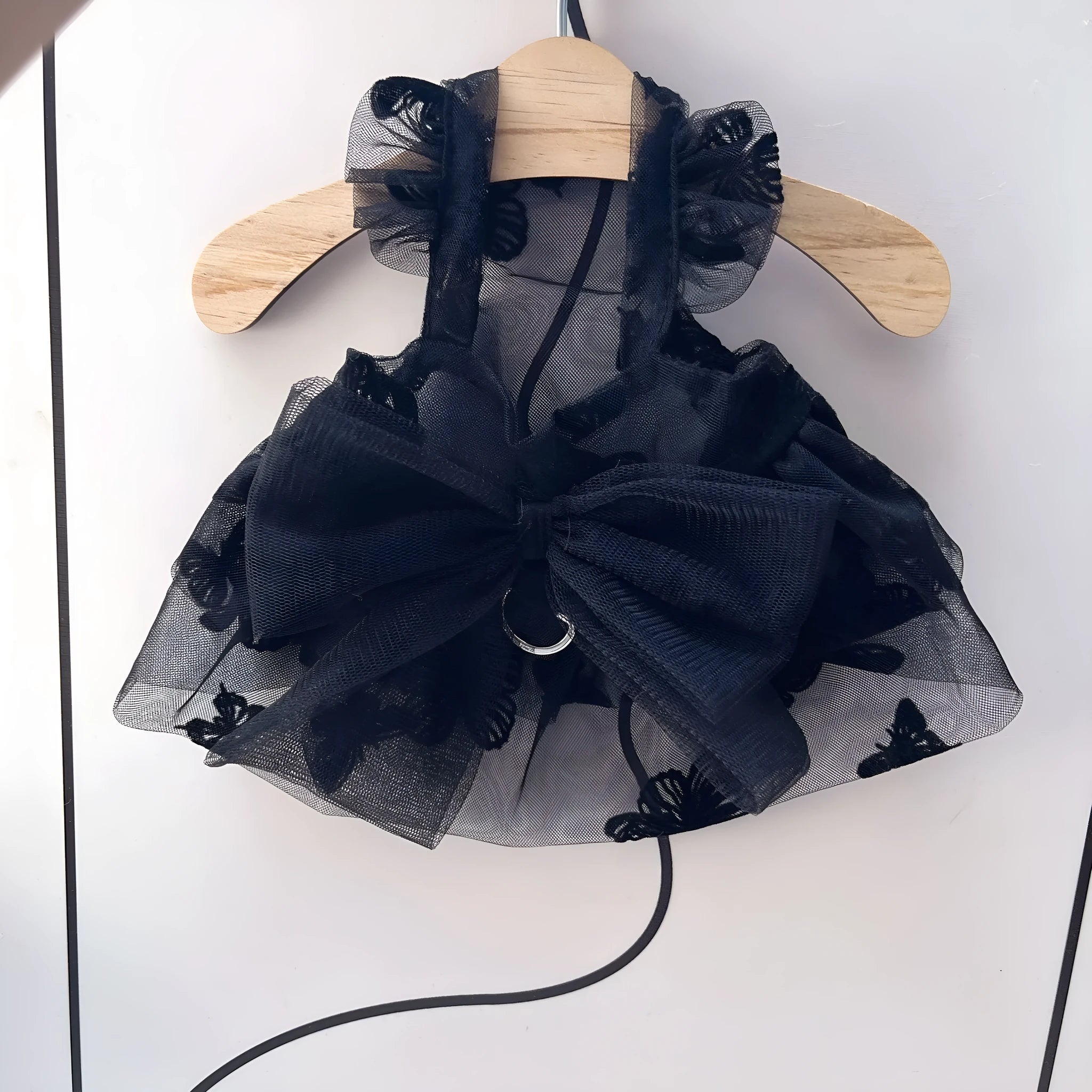 Black polyester princess tulle skirt for a small dog or cat, shown on a mannequin.