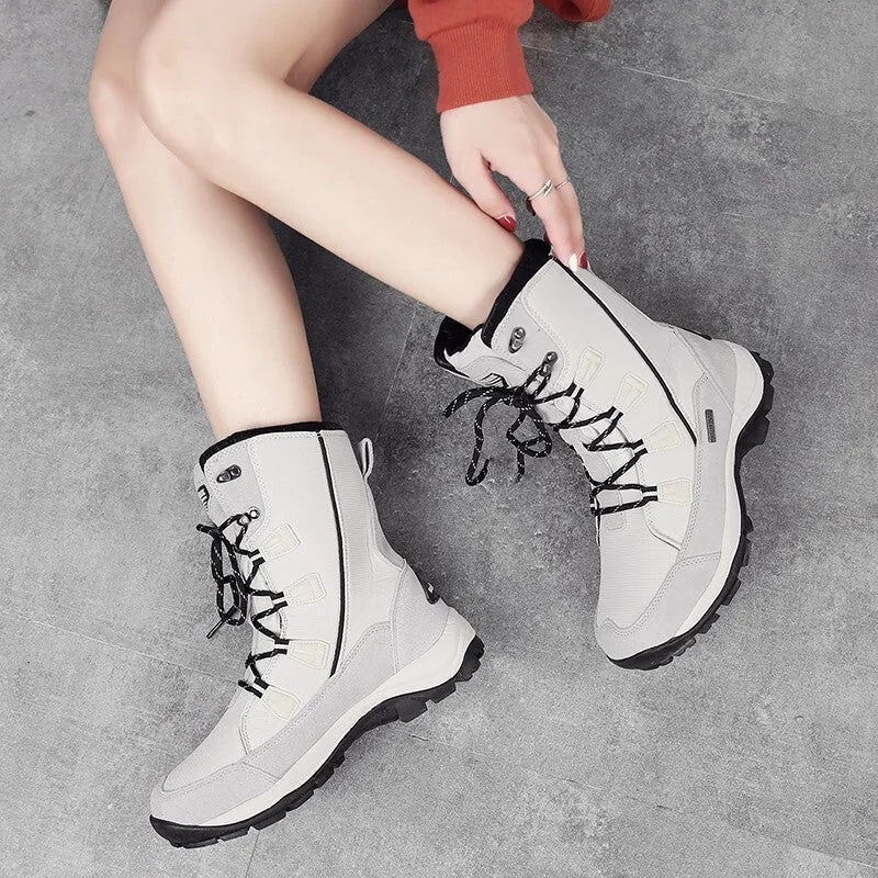Women's black thermal snow boots with genuine leather upper and rubber sole